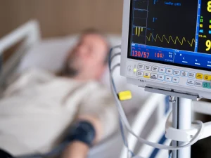 a man with a heart monitor due to heart attack